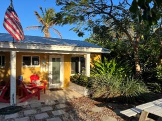 A house with a flag on the roof

Description automatically generated with medium confidence